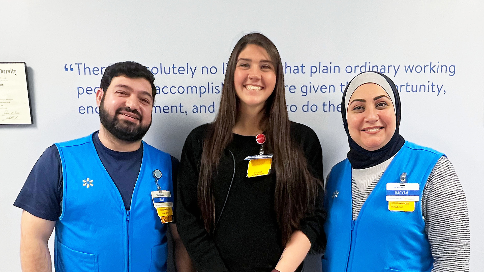 Walmart store manager Vanessa stands with Maryam and Ali, associates who use American Sign Language to communicate.