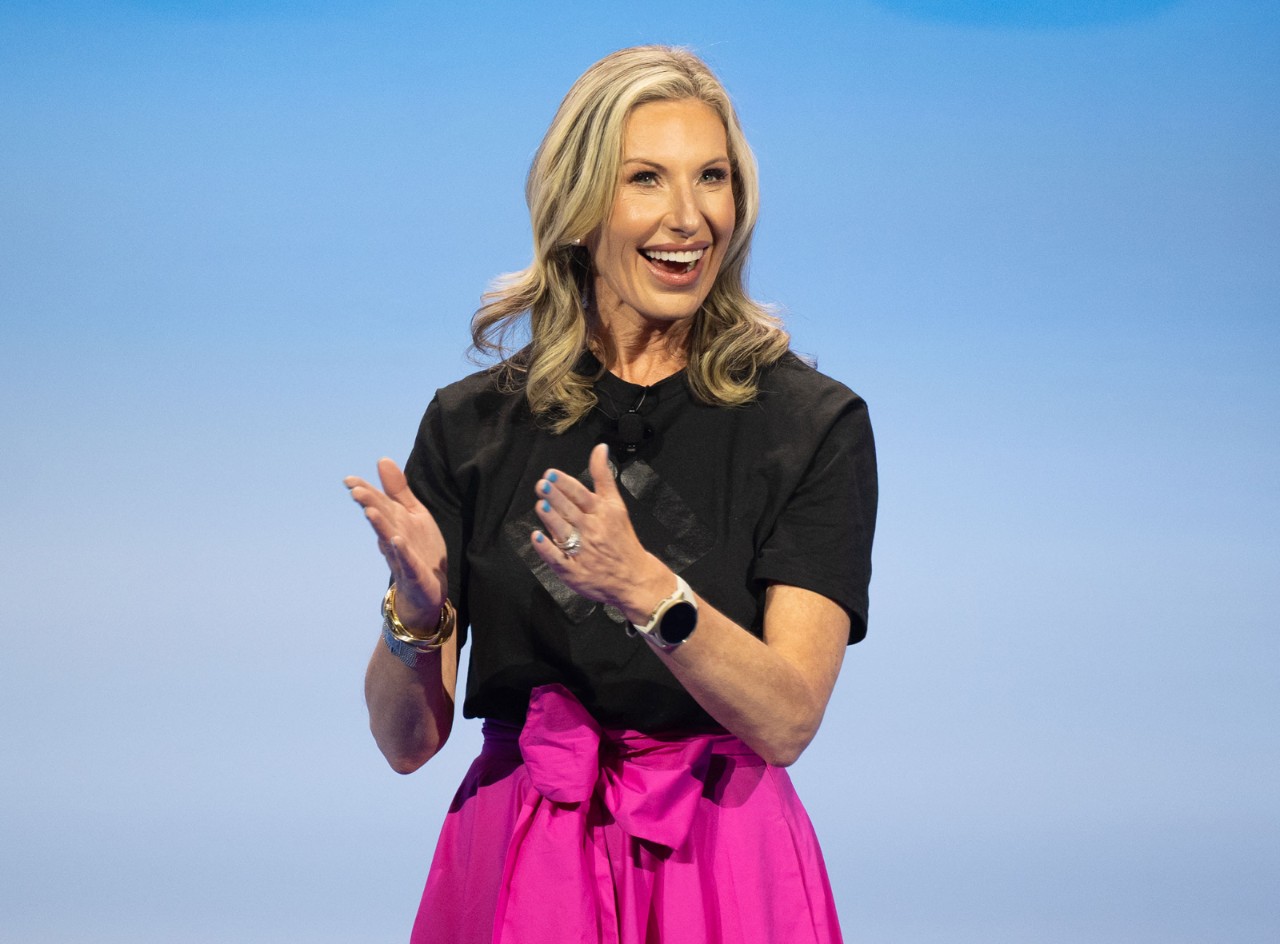 Julie Barber smiles and applauds the achievements of Sam’s Club associates at Associates Week 2025.